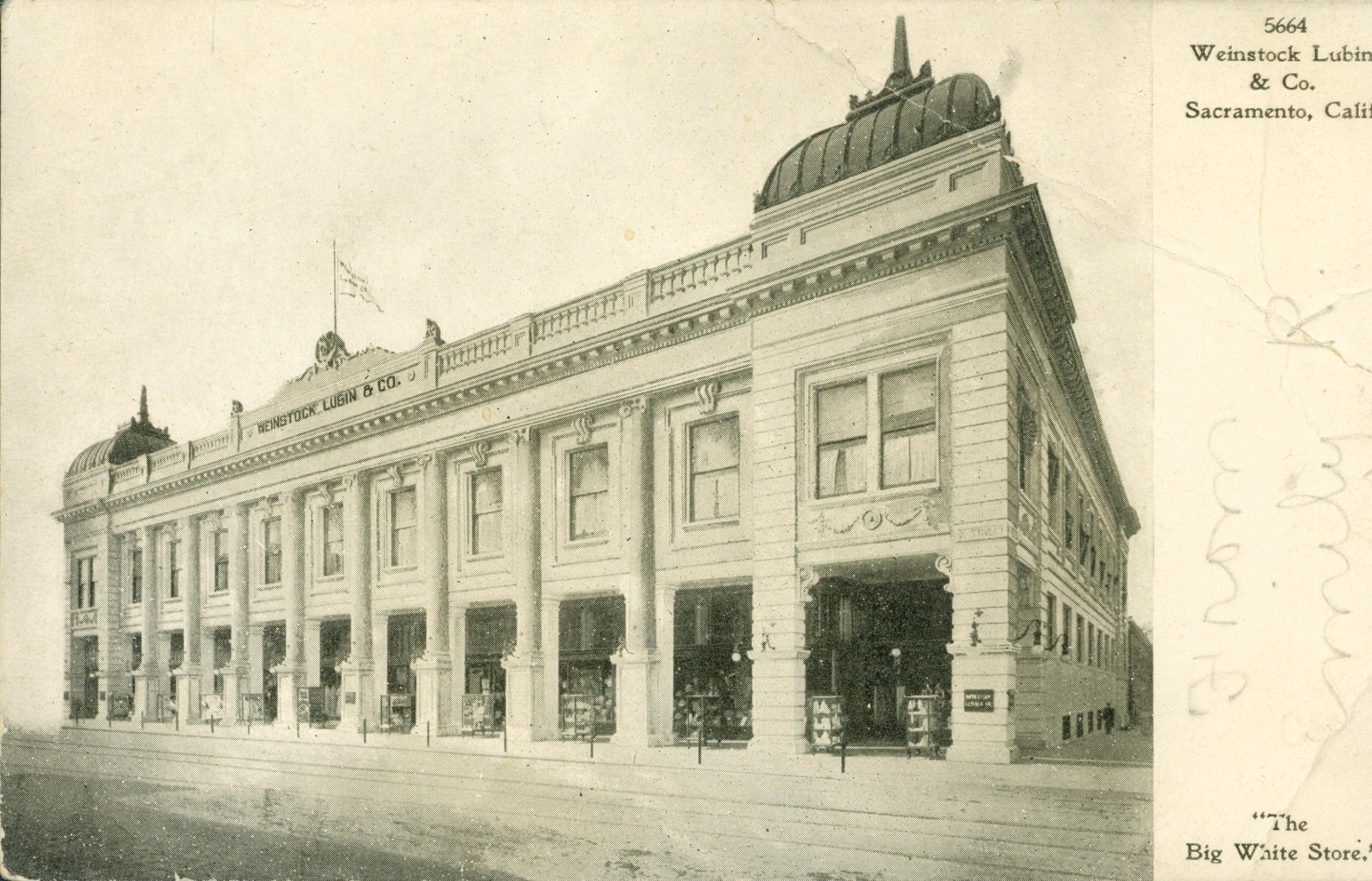 This postcard shows a corner view of the Weinstock Lubin & Co. building in Sacramento